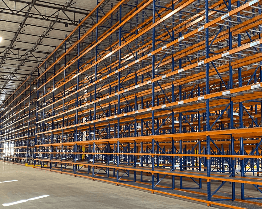 Selective pallet rack installation at a warehouse in Harrisburg, PA — loaded uprights and beams in a wide-aisle configuration